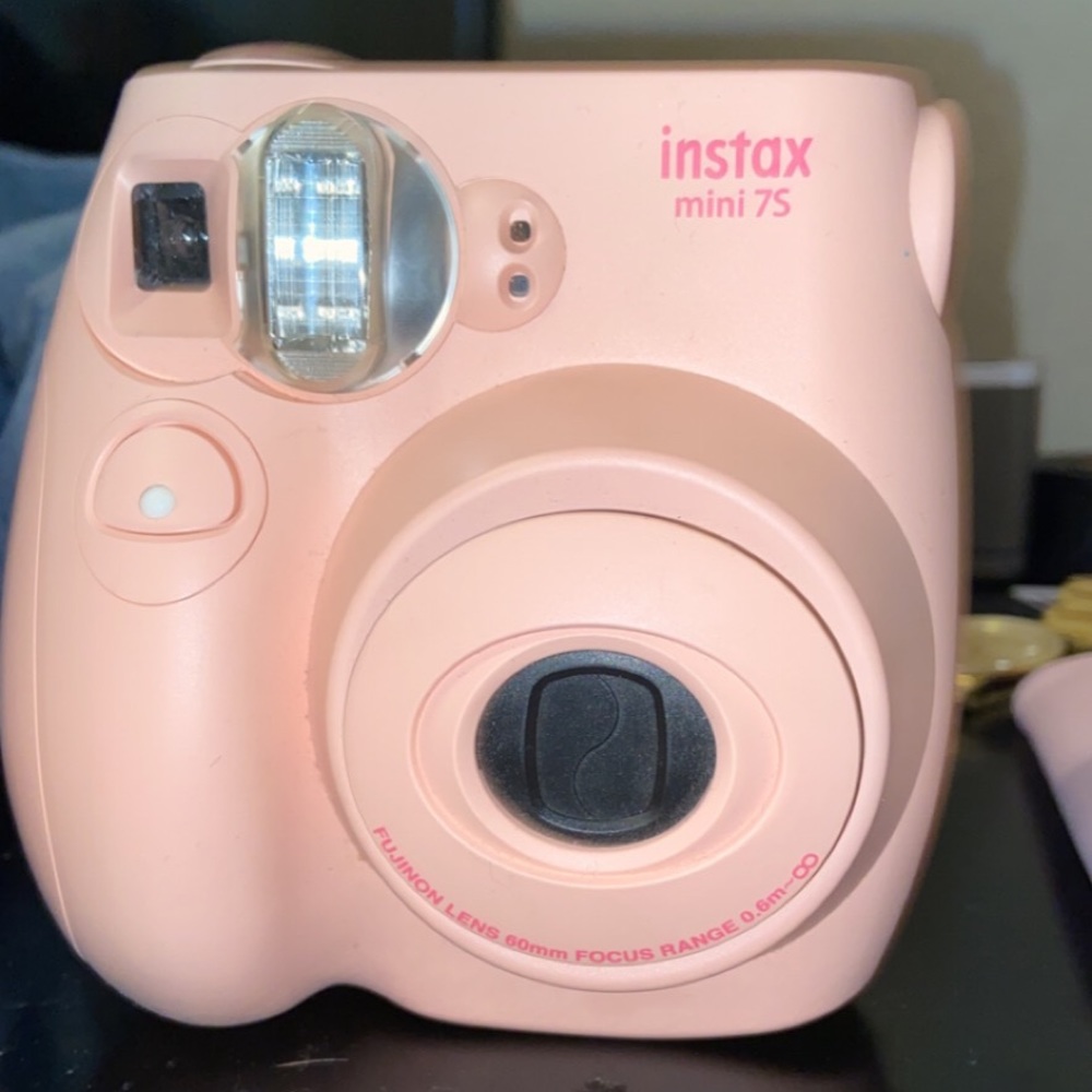 Pink Polaroid camera and photo album